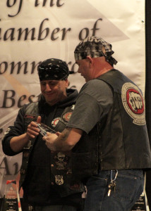Bikers Against Child Abuse members Madqat and Jurzee check out their award for Organization of the Year at the 65th Annual Best of Cedar City Awards Gala, Southern Utah University Ballroom, Cedar City, Utah, Jan. 20, 2016 | Photo by Carin Miller, St. George News