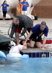 Cedar City Community Center Manager Chris Hudson and another diver help Martha Peterson out of the cold water, Cedar City Community Center, Cedar City, Utah, Jan. 30, 2016 | Photo by Carin M. Miller, St. George News