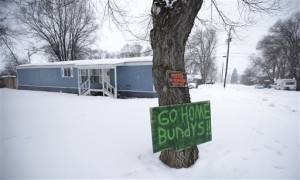 A sign referencing Ammon Bundy and his brother, who are the sons of Nevada rancher Cliven Bundy, hangs on a tree in front of a home Tuesday. Ammon Bundy, the leader of a small, armed group that is occupying a remote national wildlife preserve in Oregon said Tuesday that they will go home when a plan is in place to turn over management of federal lands to locals, Burns, Orgeon, Jan. 5, 2016 | AP Photo/Rick Bowmer, St. George News