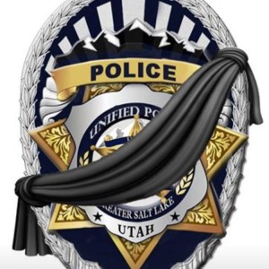 A police badge with a banner indicating a police officer has fallen | Photo courtesy of the Unified Police Department, St. George News