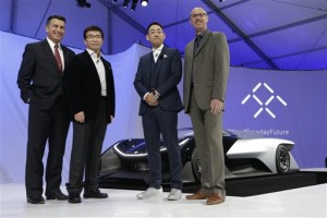 Nevada Gov. Brian Sandoval, left, poses for a photo in front of the FFZero1 by Faraday Future, alongside members of the Faraday Future team at CES Unveiled, a media preview event for CES International Monday, Jan. 4, 2016, in Las Vegas. The high-performance electric concept car was unveiled during a news conference by Faraday Future. From right are Nick Sampson, product developer, Richard Kim, head of global design, Ding Lei, and letv co-founder | AP Photo/Gregory Bull, St. George News