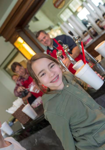 In this photo from 2015 a young girl enjoys a root beer float during St. George Heritage Day, St. George, Utah, January, 2015 | Photo by Dave Becker, St. George News