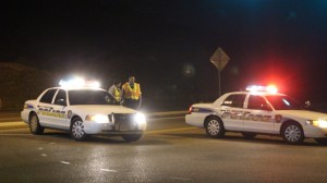 Two police units block access to Red Hills Parkway at the Skyline Drive intersection as responders deal with an accident on the east side of the Dixie Rock, St. George, Utah, Jan. 27, 2016 | Photo by Mori Kessler, St. George News