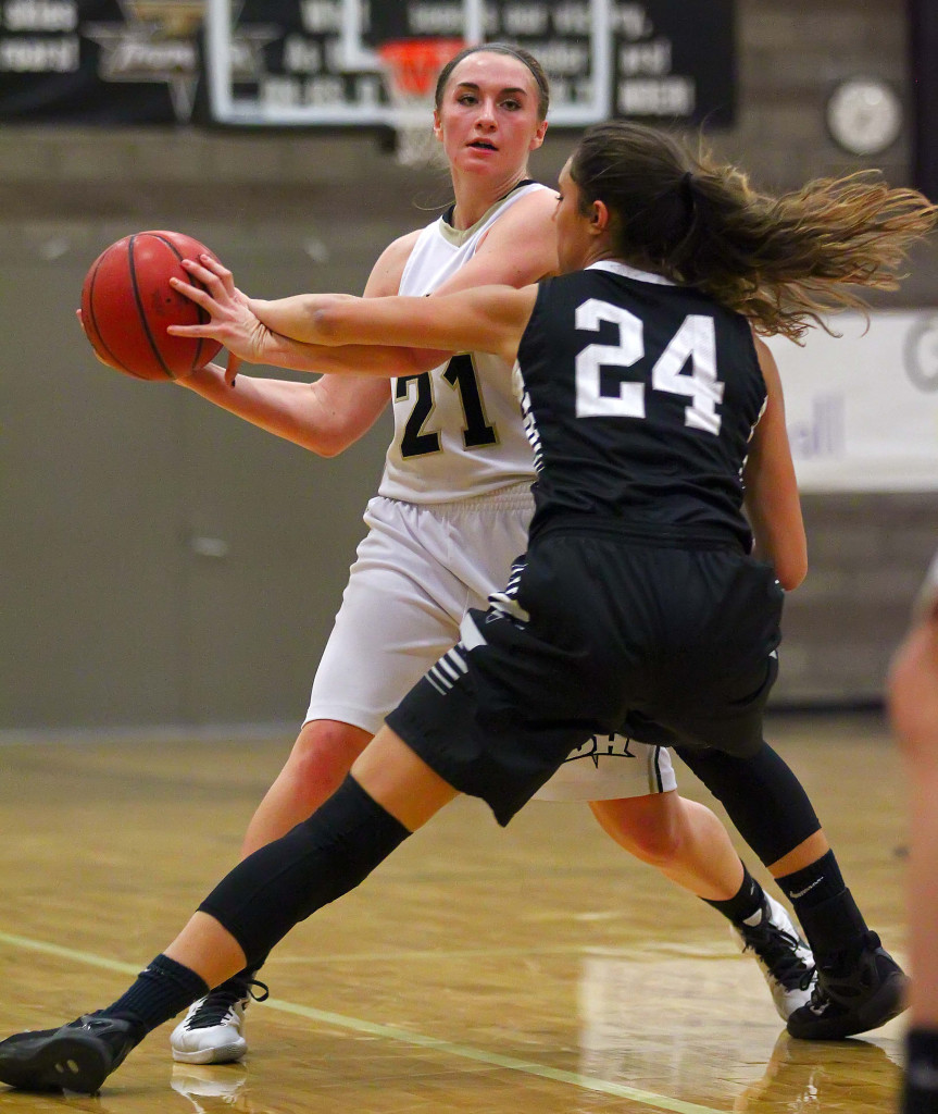 Desert Hills'  Megan Wiscombe (21) and Pine View's  Tayvia AhQuin (24), Desert Hills vs. Pine View, Girls Basketball, St. George, Utah, Feb. 9, 2016, | Photo by Robert Hoppie, ASPpix.com, St. George News