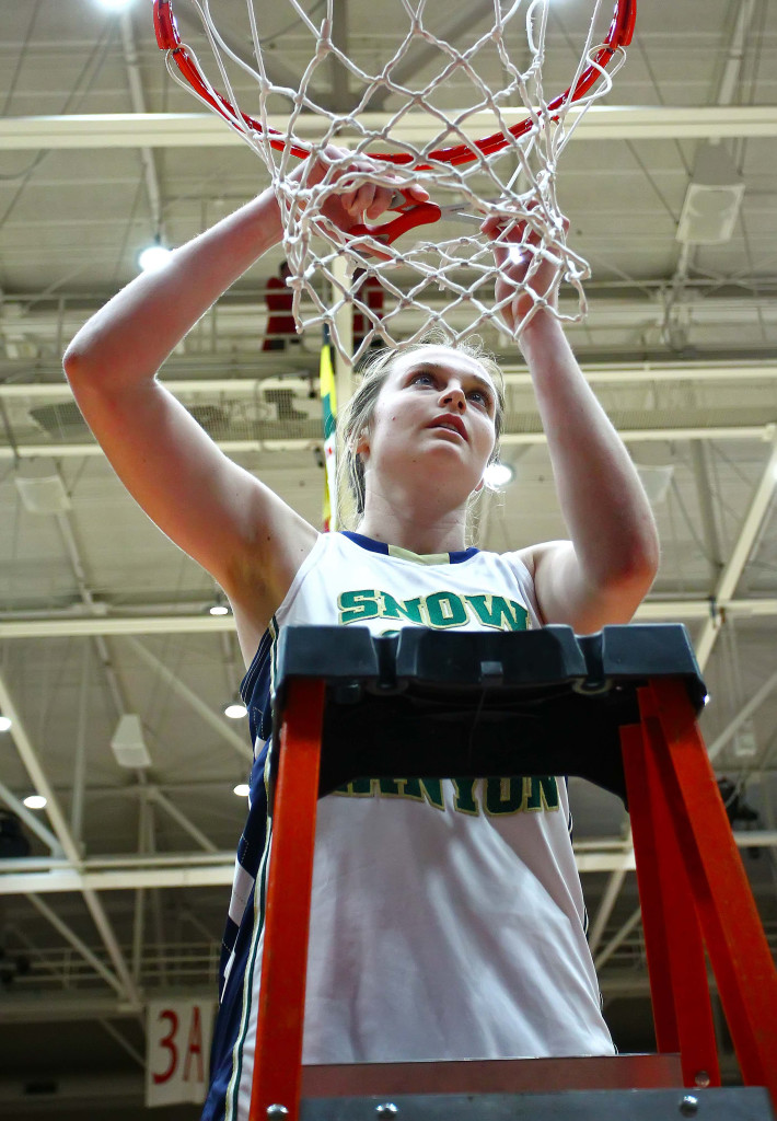 Snow Canyon's  Madison Mooring (21) cuts down the net after winning the state championship, Snow Canyon vs. Cedar, 3A State Basketball Tournament, Girls Basketball, Cedar City, Utah, Feb. 27, 2016, | Photo by Robert Hoppie, ASPpix.com, St. George News