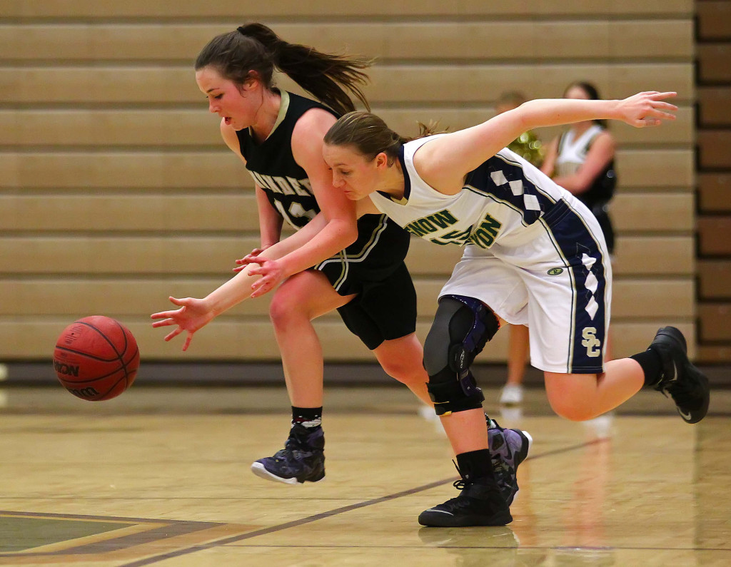 Desert Hills'  Kylie Williams (11) and Snow Canyon's  Natalie Coulam (15), Snow Canyon vs. Desert Hills, Girls Basketball,  St. George, Utah, Feb. 10, 2016, | Photo by Robert Hoppie, ASPpix.com, St. George News