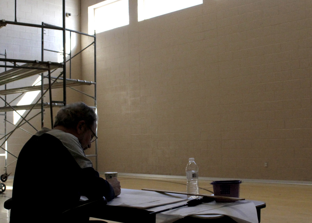 Renowned artist Emanuel Martinez maps the course for a 44-by-24 foot mural to be painted by 20 Southwest Utah Youth Center students, Cedar City, Utah, Feb. 3, 2016 | Photo by Carin Miller, St. George News 