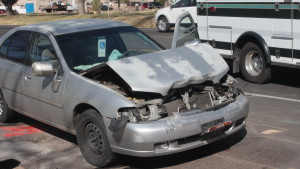 The end result of a rear-end collision between a Nissan Altima and a black Mazda which occurred on Feb. 25, 2016. | Photo by Don Gilman, St. George News