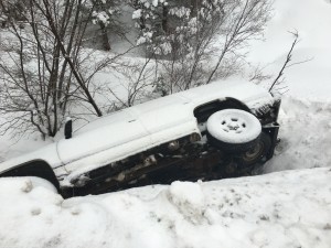 Authorities contribute a vehicle rollover on state route 143 Thursday morning to icy road conditions, Parowan, Utah, Feb. 4, 2016, | Photo by Tracie Sullivan, Cedar City News