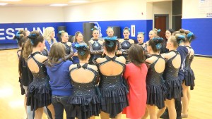 The Dixie High School Jetettes link hands and give an encouraging chant before taking the floor during halftime of the basketball game, St. George, Utah, February 12, 2016 | Screenshot from video by Austin Peck, St. George News