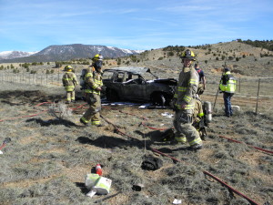 A car catches fire following a rollover authorities said was likely caused by a tire blowout. Cedar City, Utah, Feb. 27, 2016 | Photo courtesy of UHP Trooper Bambi Baie, St. George News / Cedar City News