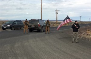 Armed law enforcement officers stand near a closed highway about 4 miles outside of the Malheur National Wildlife Refuge in Burns, Ore, after the last four occupiers of the national nature preserve surrendered on Thursday. The holdouts were the last remnants of a larger group that seized the wildlife refuge nearly six weeks ago, demanding that the government turn over the land to locals and release two ranchers imprisoned for setting fires. Burns, Oregon, Feb. 11, 2016 | Photo by Rebecca Boone(AP), St. George News