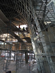 Construction workers sit atop scaffolding completing the metal work under the patio of the new museum, Cedar City, Utah, Date unspecified | Courtesy of Friends of SUMA, St. George News