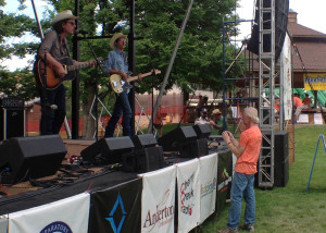 Groovefest founder Tim Cretsinger takes a moment to photograph one of this year's acts, Main Street Park, Cedar City, Utah, June 27, 2015 | Photo by Carin Miller, St. George News