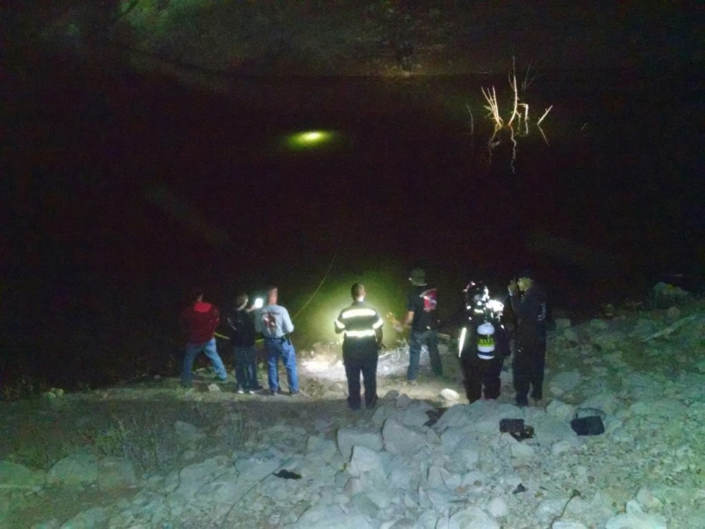 SAR divers locate vehicle and shine flashlight through water at location, Gunlock Reservoir, Utah, March 3, 2016| Photo courtesy of Deputy Darrell Cashin