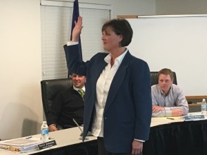 New Enoch City Councilwoman Jolene Lee is sworn in Wednesday night after the mayor tossed a coin to determine the winner in a tie vote between her and Scott Lee. Enoch City, Utah, March 2, 2016 | Photo by Tracie Sullivan, Cedar City News