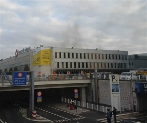 In this image provided by Daniela Schwarzer, smoke is seen at Brussels airport in Brussels, Belgium, after explosions were heard Tuesday, March 22, 2016, Brussels, Belgium, March 22, 2016. | AP Photo courtesy of Daniela Schwarzer, St. George News