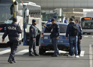 Police officers perform security checks at Fiumicino airport, near Rome, Tuesday, March 22, 2016. The Italian Interior Ministry announced heightened security measures at major Italian airports following explosions at the Brussels airport and the subway system earlier Tuesday, Brussels, Belgium, March 22, 2016. | Photo by Telenews/ANSA via AP, ITALY OUT, St. George News