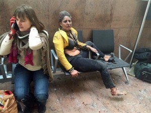 In this photo provided by Georgian Public Broadcaster and photographed by Ketevan Kardava two women wounded in Brussels Airport. A developing situation left at least one person and possibly more dead in explosions that ripped through the departure hall at Brussels airport Tuesday, police said. All flights were canceled, arriving planes were being diverted and Belgium's terror alert level was raised to maximum, officials said, Brussels, Belgium, March 22, 2016 | Photo by Ketevan Kardava/ Georgian Public Broadcaster via AP, St. George News