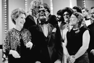 FILE -First lady Nancy Reagan, left, gets a laugh with Ray Charles, center, and Willie Nelson, right, and other entertainers at a salute to country music at Constitution Hall in Washington. The former first lady has died at 94, The Associated Press confirmed. Washington, D.C., March 16, 1983 | Photo by Ira Schwarz, Associated Press, St. George News