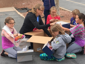 Girls on the Run of Southern Utah executive director, Melissa Miller, surprises participants of the program with new shoes at Arrowhead Elementary, Santa Clara, Utah, March 29, 2016 | Photo by Hollie Reina, St. George News