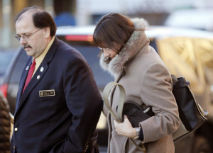 New Hampshire state Rep. Susan DeLemus, right, leaves the Federal Courthouse with state Rep. John Burt after attending a hearing for her husband Gerald DeLemus Thursday March, 3, 2016 in Concord, N.H. DeLemus of Rochester, N.H. was arrested on allegations that he organized and led armed patrols and security checkpoints for several weeks after a tense armed confrontation in April 2014 near Cliven Bundy's melon farm and cattle ranch in Bunkerville, Nevada. (AP Photo/Jim Cole)