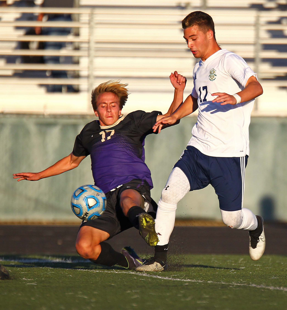 Snow Canyon's Branson Stafford (17) and Desert Hills' Bridger Nelson (17), Snow Canyon vs. Desert Hills, Soccer, St. George, Utah, Apr. 4, 2016, | Photo by Robert Hoppie, ASPpix.com, St. George News