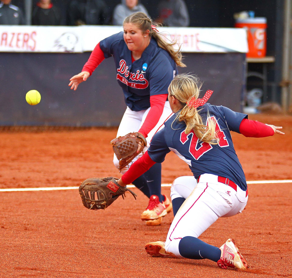 Dixie State's Brooklyn Beardshear (11) and Mallory Paulson (24) dive for a bunted ball, Dixie State University vs BYU Hawai'i, Softball, St. George, Utah, Apr. 25, 2016, | Photo by Robert Hoppie, ASPpix.com, St. George News