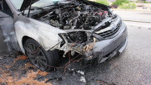 A melted engine compartment on Subaru sedan that caught fire on Interstate 15 in St. George, Utah, April 27, 2016 | Photo by Don Gilman, St. George News