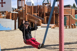 Cedar City Mayor Maile Wilson swings on the playground at Park Discovery Friday after she reopens it to the public. Cedar City, Utah, April 22, 2016 | Photo by Tracie Sullivan, St. George/Cedar City News