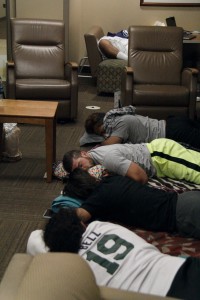 Dixie State rugby players line the ICU waiting room floor while teammate Jonah Tuttle remains in a coma at Dixie Regional Medical Center, St. George, Utah, April 19, 2016 | Photo courtesy of Just Wake Up Jonah blog, St. George News