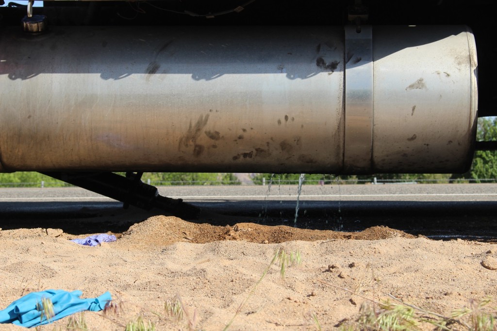 Gas tank leaking fuel after rupturing from drive line breakage, Interstate 15, Utah, Apr. 20, 2016| Photo by Cody Blowers, St. George News