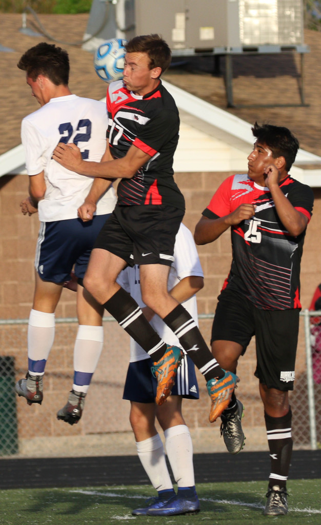 Hurricane's Zach Curtis (17) and SC's Kolton Barber, Snow Canyon vs.  Hurricane , Soccer ,  St. George, Utah, Apr. 8, 2016, | Photo by Kevin Luthy, St. George News