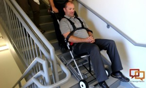 Joshua Thyan, DSU's director of risk assessment and fire marshal, is taken down a flight of stair in an special evacuation chair during a CERT team training exercise, St. George, Utah, April 21, 2016 | Photo by Mori Kessler, St. George News