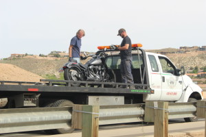 A motorcycle involved in an accident on River Road being being secured on the back of a tow truck, St. George, Utah, April 6, 2016 | Photo by Mori Kessler, St. George News
