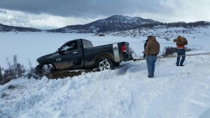 Washington County Search and Rescue volunteers pull a Florida man's truck out of the snow after the man was stranded for three days at Kolob Reservoir, Utah, March 31, 2016 | Photo courtesy Washington County, St. George News