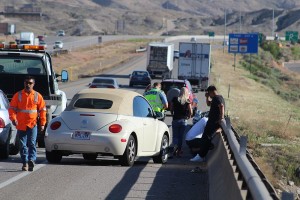 A motorcycle that was hit from behind can be seen on the right. The rider was seriously injured Tuesday. St. George, Utah, April 5, 2016 | Photo by Ric Wayman, St. George News