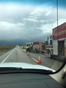 Responders from Hildale-Colorado City Fire Department and Arizona Department of Public Safety attend to a single-car rollover off state Route 389 in Arizona. Near Colorado City, Arizona, May 7, 2016 | Photo courtesy of Cody Jessop, St. George News