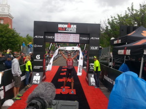 Heather Wurtele crosses the finish line in 4:16:47, first place for pro women in Ironman 70.3 St. George North American Pro Championship. St. George, Utah, May 7, 2016 | Photo by Andy Griffin, St. George News