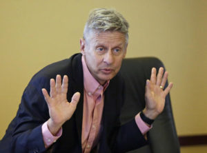 FILE - In this May 18, 2016 file photo, Libertarian presidential candidate, former New Mexico Gov. Gary Johnson speak with legislators at the Utah State Capitol in Salt Lake City. He has virtually no money, no strategy to compete in battleground states and no plan to stop talking about his drug use. Yet with the Republican Party facing the prospect of a Donald Trump presidency, Libertarian presidential hopeful Gary Johnson could be a factor in 2016. The former two-term New Mexico governor, a Republican businessman perhaps best known for his years-long push to legalize marijuana, has a sobering message for a never-Trump movement desperately seeking a viable alternative. | AP Photo by Rick Bowmer; St. George News