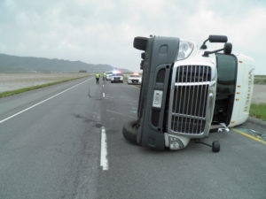 Two semis traveling eastbound on Interstate 80 near milepost 84 were both blown over by the high winds within about 5 minutes of each other, Tooele County, Utah, May 20, 2016 | Photo courtesy of Utah Highway Patrol, St. George News