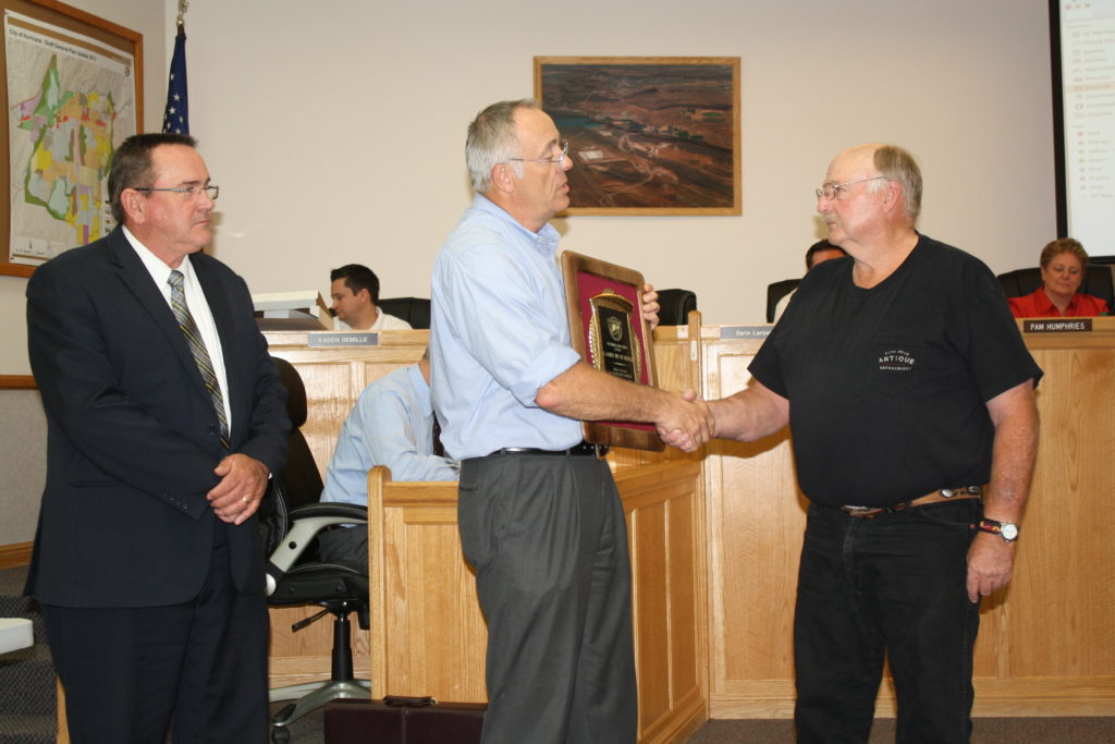 L-R: City Manager Clark Fawcett and Mayor John Bramall present 30-year service award to Larry Hutchings, Hurricane, Utah, May 19, 2016 | Photo by Reuben Wadsworth, St. George News