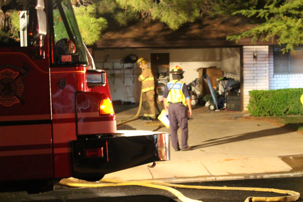 Firefighters exiting home after flames are extinguished at 1818 Wittwer Lane, Santa Clara. Utah, My 21, 2016 | Photo by Cody Blowers, St. George News