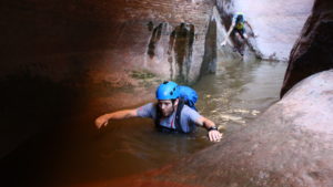 Kevin Arnone wades through chilly water, one of many such pools encountered in the descent of Yankee Doodle Canyon, Leeds, Utah, May 19, 2016 | Photo by Don Gilman, St. George News