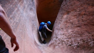 Kevin Arnone descends through the sinuous slot canyon known as Yankee Doodle Canyon, Leeds, Utah, May 19, 2016 | Photo by Don Gilman, St. George News