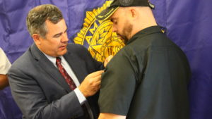 Mayor Jon Pike pins the Medal of Valor on veteran Joe Hamblin during an award ceremony at the American Legions Post 90, St. George, Utah, May 25, 2016 | Photo by Don Gilman, St. George News