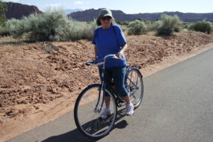  Moreen Franklin riding on Snow Canyon Parkway. Franklin was visiting from New Hampshire, getting some exercise while exploring the Ivins/Snow Canyon area. May 25, 2016| Photo courtesy of Tim Tabor, St. George News