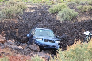 An elderly couple were injured when their car lost control on a turn on Pioneer Parkway and rolled into the lava beds. Santa Clara, Utah, May 7, 2016 | Photo by Ric Wayman, St. George News