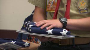 Veterans participating in the Utah Honor Flight are presented with an American flag from a member of Boy Scout troop 1495. St. George, Utah, May 28, 2016 | Photo by Austin Peck, St. George News