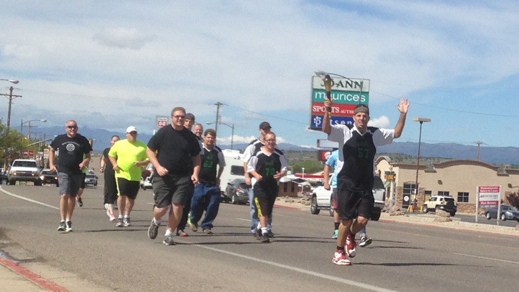 Athletes took turns running with the Flame of Hope down Main Street, Cedar City, Utah, May 18, 2016 | Photo by Paul Dail, St. George News